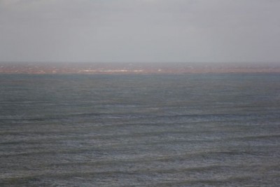 view to North West Reef from Lighthouse showing chocolate tide line post cyclone